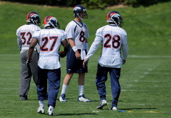 ENGLEWOOD, CO - MAY 03:  Quarterback Kyle Orton #8 particiaptes in practice during Denver Broncos Minicamp along with running backs LaMont Jordan #32, Knowshon Moreno #27 and Correll Buckhalter #28 at the Broncos training facility on May 3, 2009 in Englewood, Colorado. Moreno was the Broncos first round draft pick in the 2009 draft.  (Photo by Doug Pensinger/Getty Images)