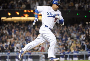 LOS ANGELES, CA - APRIL 30:  Manny Ramirez #99 of the Los Angeles Dodgers hits a homerun for a 4-3 lead against the San Diego Padres during the third inning at Dodger Stadium on April 30, 2009 in Los Angeles, California.  (Photo by Harry How/Getty Images)