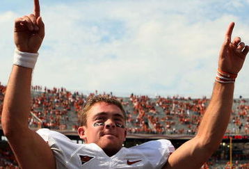 DALLAS - OCTOBER 11:  Quarterback Colt McCoy #12 of the Texas Longhorns celebrates a 45-35 win against the Oklahoma Sooners during the Red River Rivalry at the Cotton Bowl on October 11, 2008 in Dallas, Texas.  (Photo by Ronald Martinez/Getty Images)