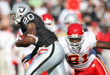 OAKLAND, CA - NOVEMBER 30:  Devard Darling #81 of the Kansas City Chiefs tackles Darren McFadden #20 of the Oakland Raiders during an NFL game on November 30, 2008 at the Oakland-Alameda County Coliseum in Oakland, California. (Photo by Jed Jacobsohn/Getty Images)