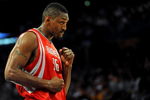 LOS ANGELES, CA - MAY 06:  Ron Artest #96 of the Houston Rockets looks over at a fan in the second quarter against the Los Angeles Lakers in Game Two of the Western Conference Semifinals during the 2009 NBA Playoffs at Staples Center on May 6, 2009 in Los Angeles, California. NOTE TO USER: User expressly acknowledges and agrees that, by downloading and or using this photograph, User is consenting to the terms and conditions of the Getty Images License Agreement.  (Photo by Harry How/Getty Images)