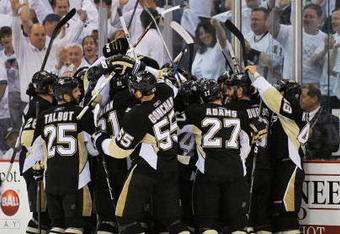 PITTSBURGH - MAY 06:  The Pittsburgh Penguins celebrate their overtime victory over the Washington Capitals during Game Three of the Eastern Conference Semifinal Round of the 2009 Stanley Cup Playoffs at Mellon Arena on May 6, 2009 in Pittsburgh, Pennsylvania. The Penguins defeated the Capitals 3-2. (Photo by Jamie Sabau/Getty Images)