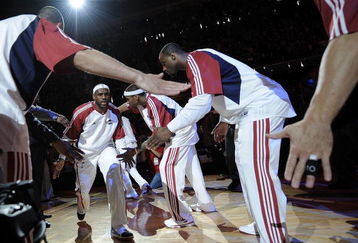 CLEVELAND - MAY 07:  LeBron James #23 of the Cleveland Cavaliers comes though a line of teammates during player introductions prior to playing the Atlanta Hawks in Game Two of the Eastern Conference Semifinals during the 2009 NBA Playoffs at Quicken Loans Arena on May 7, 2009 in Cleveland, Ohio. Cleveland won the game 105-85 to take a 2-0 series lead. NOTE TO USER: User expressly acknowledges and agrees that, by downloading and or using this photograph, User is consenting to the terms and conditions of the Getty Images License Agreement.  (Photo by Gregory Shamus/Getty Images)