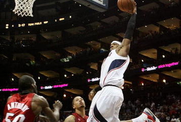 ATLANTA - MAY 03:  Josh Smith #5 of the Atlanta Hawks dunks over Joel Anthony #50 and Michael Beasley #30 of the Miami Heat during Game Seven of the Eastern Conference Quarterfinals at Philips Arena on May 3, 2009 in Atlanta, Georgia. The Hawks defeated the Heat 91-78. NOTE TO USER: User expressly acknowledges and agrees that, by downloading and/or using this Photograph, user is consenting to the terms and conditions of the Getty Images License Agreement.  (Photo by Doug Benc/Getty Images)