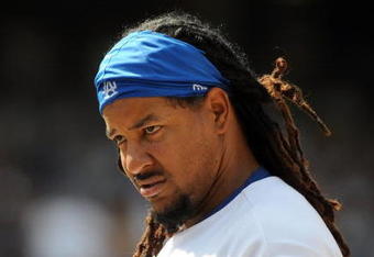 LOS ANGELES, CA - APRIL 19:  Manny Ramirez #99 of the Los Angeles Dodgers on base against the Colorado Rockies during the game at Dodger Stadium on April 19, 2009 in Los Angeles, California.  (Photo by Harry How/Getty Images)