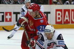 BERN, SWITZERLAND - MAY 08:  Konstantin Gorovikov of Russia battles with John Michael Liles of USA during the IIHF World Championship Semi-Final between USA and Russia at the PostFinance Arena on May 8, 2009 in Bern, Switzerland.  (Photo by Mike Hewitt/Getty Images)