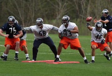 LAKE FOREST, IL - MAY 01: (L-R) Dave Peck #75, Marcus Freeman #58, Jarron Gilbert#73 and Al Afalava #46 of the Chicago Bears participate in a special teams drill during a rookie mini-camp practice on May 1, 2009 at Halas Hall in Lake Forest, Illinois. (Photo by Jonathan Daniel/Getty Images)