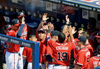 ATLANTA - APRIL 12: Infielder Yunel Escobar #19 of the Atlanta Braves celebrates a score against the Washington Nationals April 12, 2009 at Turner Field in Atlanta, Georgia.  (Photo by Al Messerschmidt/Getty Images)
