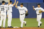 TORONTO - APRIL 6: (L-R) Lyle Overbay #35, Scott Rolen #33, Travis Snider #45, Aaron Hill #2 of the Toronto Blue Jays celebrate the win over the Detroit Tigers during the Opening Day game at the Rogers Centre on April 6, 2009 in Toronto, Ontario. (Photo by: Dave Sandford/Getty Images)