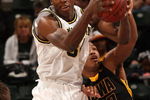 INDIANAPOLIS - MARCH 12:  DeShawn Sims #34 of the Michigan Wolveriens pulls down a rebound against Jarryd Cole #50 of the Iowa Hawkeyes during the first round of the Big Ten Men's Basketball Tournament at Conseco Fieldhouse on March 12, 2009 in Indianapolis, Indiana.  (Photo by Jonathan Daniel/Getty Images)