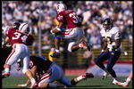 18 Nov 1995:  Running back Mike Mitchell of the Stanford Cardinal leaps over an offensive lineman as he carries the football during the Cardinal's 29-24 victory over the California Golden Bears at Stanford Stadium in Stanford, California.  Mandatory Credi