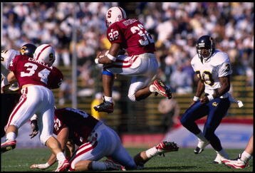 18 Nov 1995:  Running back Mike Mitchell of the Stanford Cardinal leaps over an offensive lineman as he carries the football during the Cardinal's 29-24 victory over the California Golden Bears at Stanford Stadium in Stanford, California.  Mandatory Credi