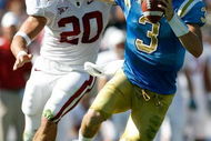 PASADENA, CA - OCTOBER 18:  Kevin Craft #3 of the UCLA Bruins runs away from Clinton Snyder #20 of the Stanford Cardinal during the first half on October 18, 2008 at the Rose Bowl in Pasadena, California.  (Photo by Harry How/Getty Images)