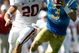 PASADENA, CA - OCTOBER 18: Kevin Craft #3 of the UCLA Bruins runs away from Clinton Snyder #20 of the Stanford Cardinal during the first half on October 18, 2008 at the Rose Bowl in Pasadena, California. (Photo by Harry How/Getty Images)
