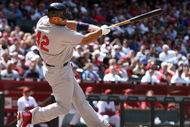 PHOENIX - APRIL 15:  Albert Pujols of the St. Louis Cardinals hits an RBI fielder's choice against the Arizona Diamondbacks during the fourth inning of the game at Chase Field April 15, 2009 in Phoenix, Arizona. All Major League Baseball players are wearing #42 in honor of Jackie Robinson day. (Photo by Christian Petersen/Getty Images)