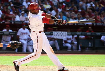 PHOENIX - APRIL 29:  Justin Upton #10 of the Arizona Diamondbacks hits a three-RBI double against the Chicago Cubs during the seventh inning at Chase Field on April 29, 2009 in Phoenix, Arizona.  The Diamondbacks defeated the Cubs 10-0.  (Photo by Christian Petersen/Getty Images)