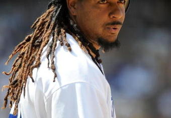LOS ANGELES, CA - APRIL 19:  Manny Ramirez #99 of the Los Angeles Dodgers on base against the Colorado Rockies during the game at Dodger Stadium on April 19, 2009 in Los Angeles, California.  (Photo by Harry How/Getty Images)