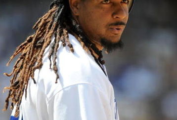 LOS ANGELES, CA - APRIL 19:  Manny Ramirez #99 of the Los Angeles Dodgers on base against the Colorado Rockies during the game at Dodger Stadium on April 19, 2009 in Los Angeles, California.  (Photo by Harry How/Getty Images)