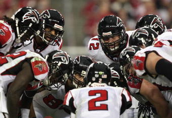 GLENDALE, AZ - JANUARY 03:   The Atlanta Falcons huddle around quarterback Matt Ryan #2 in the NFC Wild Card Game against the Arizona Cardinals on January 3, 2009 at University of Phoenix Stadium in Glendale, Arizona. The Cardinals defeated the Falcons 30-24.  (Photo by Jed Jacobsohn/Getty Images)
