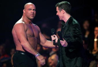 LOS ANGELES, CA - DECEMBER 08:  Presenters wrestler Kurt Angel (L) and Video game journalist Geoff Keighley speak onstage during the 4th Annual Spike TV 2006 Video Game Awards held at The Galen Center on December 8, 2006 in Los Angeles, California.  (Photo by Vince Bucci/Getty Images for Spike TV)