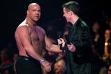 LOS ANGELES, CA - DECEMBER 08:  Presenters wrestler Kurt Angel (L) and Video game journalist Geoff Keighley speak onstage during the 4th Annual Spike TV 2006 Video Game Awards held at The Galen Center on December 8, 2006 in Los Angeles, California.  (Photo by Vince Bucci/Getty Images for Spike TV)