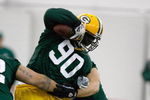 GREEN BAY, WI - MAY 1:  Defensive lineman B.J. Raji #90 runs with the football as he participates in practice drills during Green Bay Packers Minicamp at Don Hutson Center on May 1, 2009 in Green Bay, Wisconsin. (Photo by Scott Boehm/Getty Images)