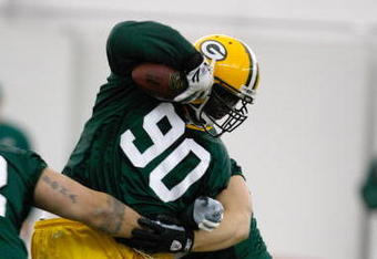 GREEN BAY, WI - MAY 1:  Defensive lineman B.J. Raji #90 runs with the football as he participates in practice drills during Green Bay Packers Minicamp at Don Hutson Center on May 1, 2009 in Green Bay, Wisconsin. (Photo by Scott Boehm/Getty Images)