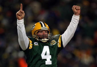 GREEN BAY, WI - JANUARY 20:  Quarterback Brett Favre #4 of the Green Bay Packers reacts after a Packers touchdown during the NFC championship game against the New York Giants on January 20, 2008 at Lambeau Field in Green Bay, Wisconsin. The Giants defeated the Packers 23-20 in overtime to advance to the Superbowl XLII.  (Photo by Jonathan Daniel/Getty Images)