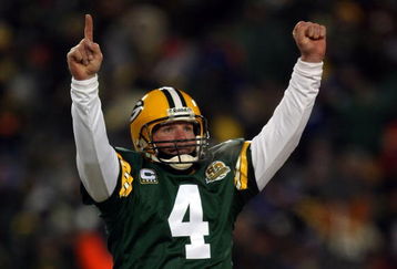 GREEN BAY, WI - JANUARY 20:  Quarterback Brett Favre #4 of the Green Bay Packers reacts after a Packers touchdown during the NFC championship game against the New York Giants on January 20, 2008 at Lambeau Field in Green Bay, Wisconsin. The Giants defeated the Packers 23-20 in overtime to advance to the Superbowl XLII.  (Photo by Jonathan Daniel/Getty Images)