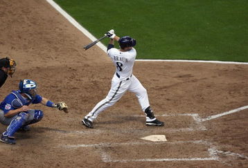 MILWAUKEE - APRIL 10: Ryan Braun #8 of the Milwaukee Brewers follows his hit against the Chicago Cubs during the Opening Day game on April 10, 2009 at Miller Park in Milwaukee, Wisconsin. The Brewers defeated the Cubs 4-3. (Photo by Jonathan Daniel/Getty Images)