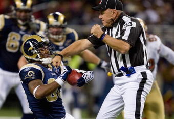 ST. LOUIS, MO - DECEMBER 21: Kenneth Darby #33 of the St. Louis Rams runs into umpire Garth DeFelice #53 against the San Francisco 49ers at the Edward Jones Dome on December 21, 2008 in St. Louis, Missouri.  The 49ers beat the Rams 17-16.  (Photo by Dilip Vishwanat/Getty Images)