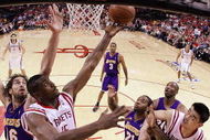 HOUSTON - MAY 08:  Guard Ron Artest #96 of the Houston Rockets takes a shot against Pau Gasol #16 of the Los Angeles Lakers in Game Three of the Western Conference Semifinals during the 2009 NBA Playoffs at Toyota Center on May 8, 2009 in Houston, Texas. NOTE TO USER: User expressly acknowledges and agrees that, by downloading and or using this photograph, User is consenting to the terms and conditions of the Getty Images License Agreement.  (Photo by Ronald Martinez/Getty Images)