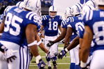 INDIANAPOLIS - DECEMBER 28:  Peyton Manning #18 of the Indianapolis Colts is greeted by teammates during player introductions prior to the first half of the game against the Tennessee Titans at Lucas Oil Stadium December 28, 2008 in Indianapolis, Indiana.  (Photo by Jamie Squire/Getty Images)