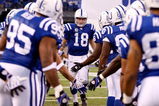 INDIANAPOLIS - DECEMBER 28:  Peyton Manning #18 of the Indianapolis Colts is greeted by teammates during player introductions prior to the first half of the game against the Tennessee Titans at Lucas Oil Stadium December 28, 2008 in Indianapolis, Indiana.  (Photo by Jamie Squire/Getty Images)
