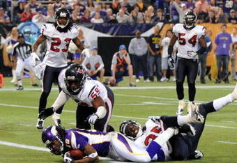 MINNEAPOLIS - NOVEMBER 02:  Sidney Rice #18 of the Minnesota Vikings crosses the goal line as he is hit by DeMeco Ryans #59 and Jacques Reeves #35 of the Houston Texans to score a touchdown during the second quarter at the Hubert H. Humphrey Metrodome on November 2, 2008 in Minneapolis, Minnesota.  (Photo by Harry How/Getty Images)