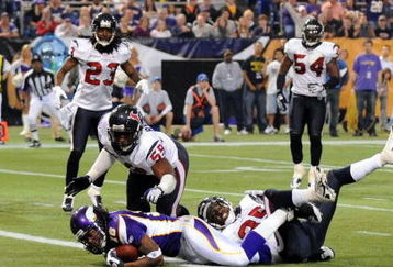 MINNEAPOLIS - NOVEMBER 02:  Sidney Rice #18 of the Minnesota Vikings crosses the goal line as he is hit by DeMeco Ryans #59 and Jacques Reeves #35 of the Houston Texans to score a touchdown during the second quarter at the Hubert H. Humphrey Metrodome on November 2, 2008 in Minneapolis, Minnesota.  (Photo by Harry How/Getty Images)