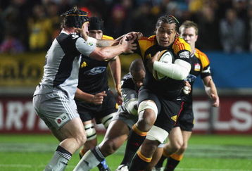HAMILTON, NEW ZEALAND - MAY 09:  Sione Lauaki of the Chiefs (R) fends off Andrew Hore of the Hurricanes during the round 13 Super 14 match between the Chiefs and the Hurricanes at Waikato Stadium on May 9, 2009 in Hamilton, New Zealand.  (Photo by Sandra Mu/Getty Images)