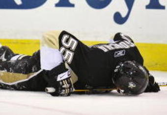 PITTSBURGH - MAY 08:  Defenseman Sergei Gonchar #55 of the Pittsburgh Penguins lies on the ice after being injured in a collision with Alex Ovechkin #8 of the Washington Capitals during Game Four of the Eastern Conference Semifinal Round of the 2009 Stanley Cup Playoffs at Mellon Arena on May 8, 2009 in Pittsburgh, Pennsylvania.  (Photo by Jamie Sabau/Getty Images)
