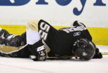 PITTSBURGH - MAY 08:  Defenseman Sergei Gonchar #55 of the Pittsburgh Penguins lies on the ice after being injured in a collision with Alex Ovechkin #8 of the Washington Capitals during Game Four of the Eastern Conference Semifinal Round of the 2009 Stanley Cup Playoffs at Mellon Arena on May 8, 2009 in Pittsburgh, Pennsylvania.  (Photo by Jamie Sabau/Getty Images)