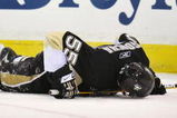 PITTSBURGH - MAY 08:  Defenseman Sergei Gonchar #55 of the Pittsburgh Penguins lies on the ice after being injured in a collision with Alex Ovechkin #8 of the Washington Capitals during Game Four of the Eastern Conference Semifinal Round of the 2009 Stanley Cup Playoffs at Mellon Arena on May 8, 2009 in Pittsburgh, Pennsylvania.  (Photo by Jamie Sabau/Getty Images)