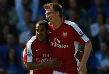 PORTSMOUTH, UNITED KINGDOM - MAY 02:  Nicklas Bendtner of Arsenal (R) celebrates with team mate Theo Walcott as he scores their first goal during the Barclays Premier League match between Portsmouth and Arsenal at Fratton Park on May 2, 2009 in Portsmouth, England.  (Photo by Paul Gilham/Getty Images)