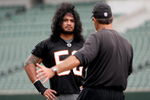 CINCINNATI, OH - MAY 1:  Cincinnati Bengals second round draft pick Rey Maualuga #58 listens to linebackers coach Jeff Fitgerald during rookie minicamp at Paul Brown Stadium on May 1, 2009 in Cincinnati, Ohio.  (Photo by Mark Lyons/Getty Images)
