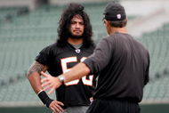CINCINNATI, OH - MAY 1:  Cincinnati Bengals second round draft pick Rey Maualuga #58 listens to linebackers coach Jeff Fitgerald during rookie minicamp at Paul Brown Stadium on May 1, 2009 in Cincinnati, Ohio.  (Photo by Mark Lyons/Getty Images)