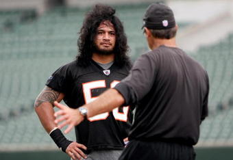 CINCINNATI, OH - MAY 1:  Cincinnati Bengals second round draft pick Rey Maualuga #58 listens to linebackers coach Jeff Fitgerald during rookie minicamp at Paul Brown Stadium on May 1, 2009 in Cincinnati, Ohio.  (Photo by Mark Lyons/Getty Images)