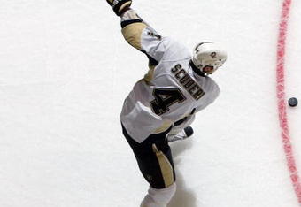 UNIONDALE, NY - FEBRUARY 16:  Rob Scuderi #4 of the Pittsburgh Penguins warms up before playing the New York Islanders on February 16, 2009 at Nassau Coliseum in Uniondale, New York.  (Photo by Jim McIsaac/Getty Images)