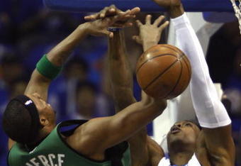 ORLANDO, FL - MAY 08:  Dwight Howard #12 of the Orlando Magic blocks a shot by Paul Pierce #34 of the Boston Celtics in Game Three of the Eastern Conference Semifinals during the 2009 NBA Playoffs at Amway Arena on May 8, 2009 in Orlando, Florida. NOTE TO USER: User expressly acknowledges and agrees that, by downloading and or using this photograph, User is consenting to the terms and conditions of the Getty Images License Agreement.  (Photo by Marc Serota/Getty Images)