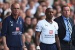 LONDON - MAY 02: Jermain Defoe of Tottenham Hotspur waits to come on with Manager Harry Redknapp and Joe Jordan (L) during the Barclays Premier League match between Tottenham Hotspur and West Bromwich Albion at White Hart Lane on May 2, 2009 in London, England.  (Photo by Bryn Lennon/Getty Images)