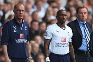LONDON - MAY 02: Jermain Defoe of Tottenham Hotspur waits to come on with Manager Harry Redknapp and Joe Jordan (L) during the Barclays Premier League match between Tottenham Hotspur and West Bromwich Albion at White Hart Lane on May 2, 2009 in London, England.  (Photo by Bryn Lennon/Getty Images)