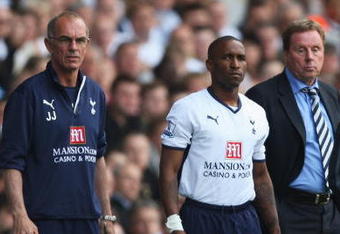 LONDON - MAY 02: Jermain Defoe of Tottenham Hotspur waits to come on with Manager Harry Redknapp and Joe Jordan (L) during the Barclays Premier League match between Tottenham Hotspur and West Bromwich Albion at White Hart Lane on May 2, 2009 in London, England.  (Photo by Bryn Lennon/Getty Images)
