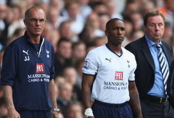 LONDON - MAY 02: Jermain Defoe of Tottenham Hotspur waits to come on with Manager Harry Redknapp and Joe Jordan (L) during the Barclays Premier League match between Tottenham Hotspur and West Bromwich Albion at White Hart Lane on May 2, 2009 in London, England.  (Photo by Bryn Lennon/Getty Images)